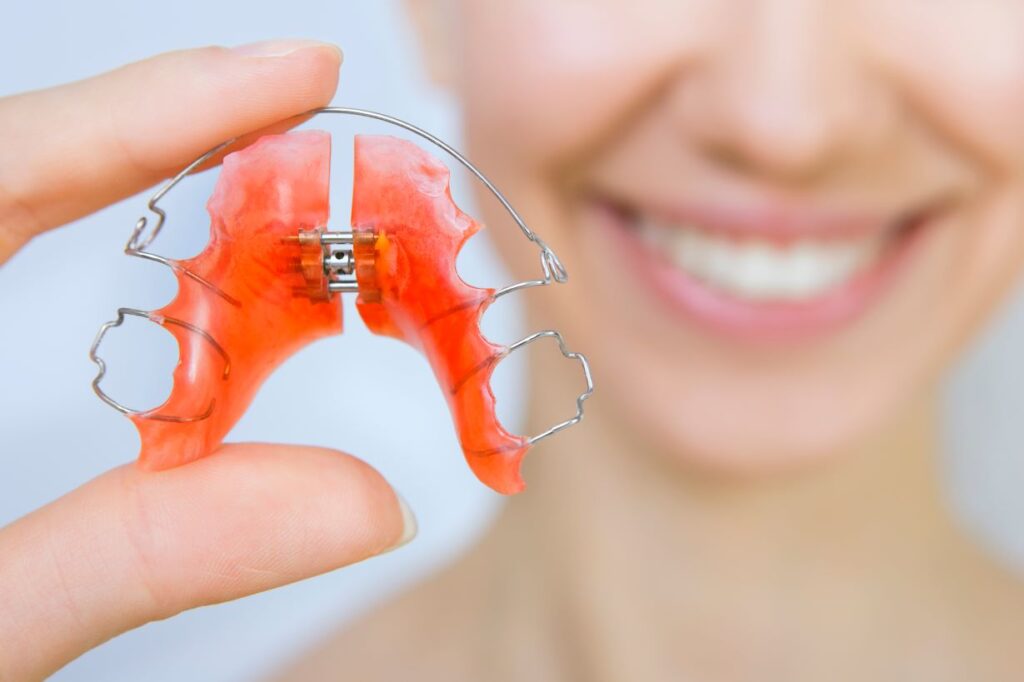 A woman holding a retainer